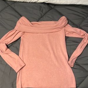 Woman’s light pink off the shoulder sweater